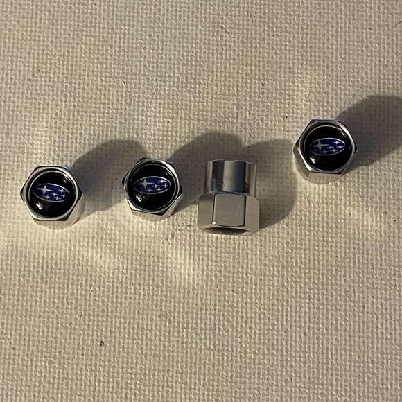 Subaru logo valve Stem caps in Silver set of 4 NWT - Picture 1 of 4